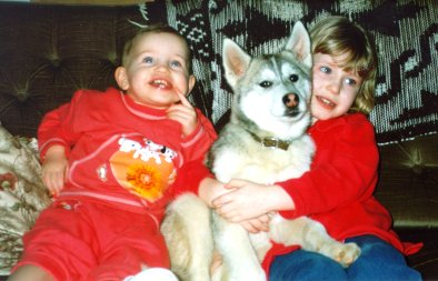 Katie, a husky puppy and Sarah, when they were all much younger