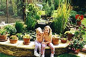 Sarah, Katie, a pond & a husky!